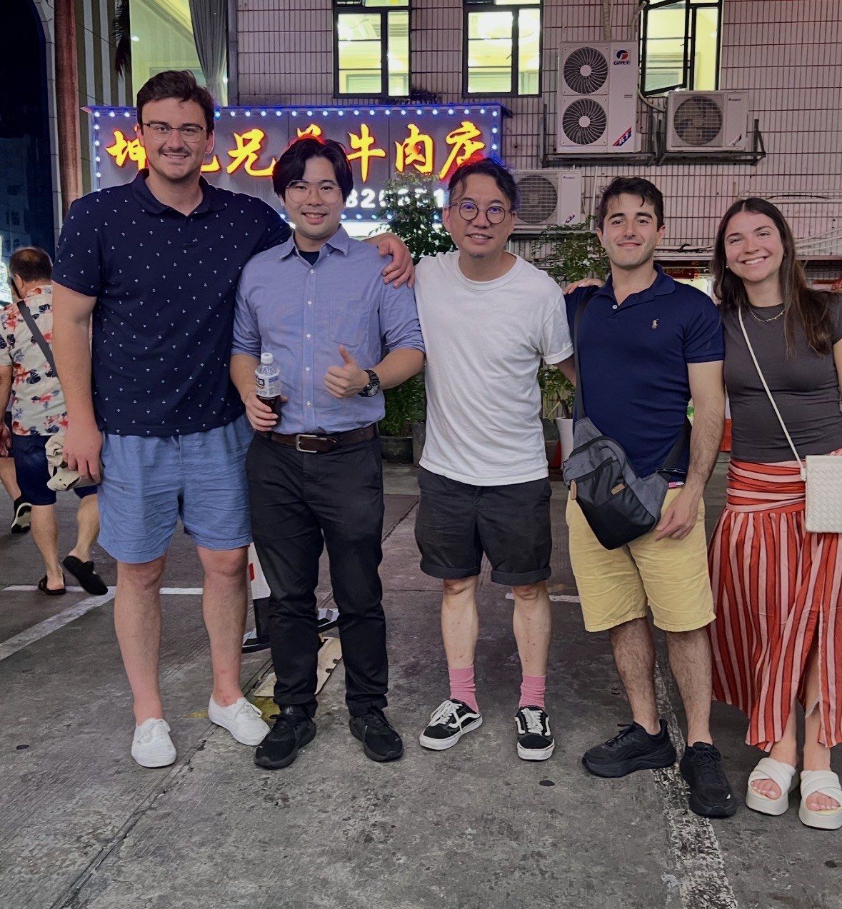 Curtis and the founders on a Shenzhen street at night.