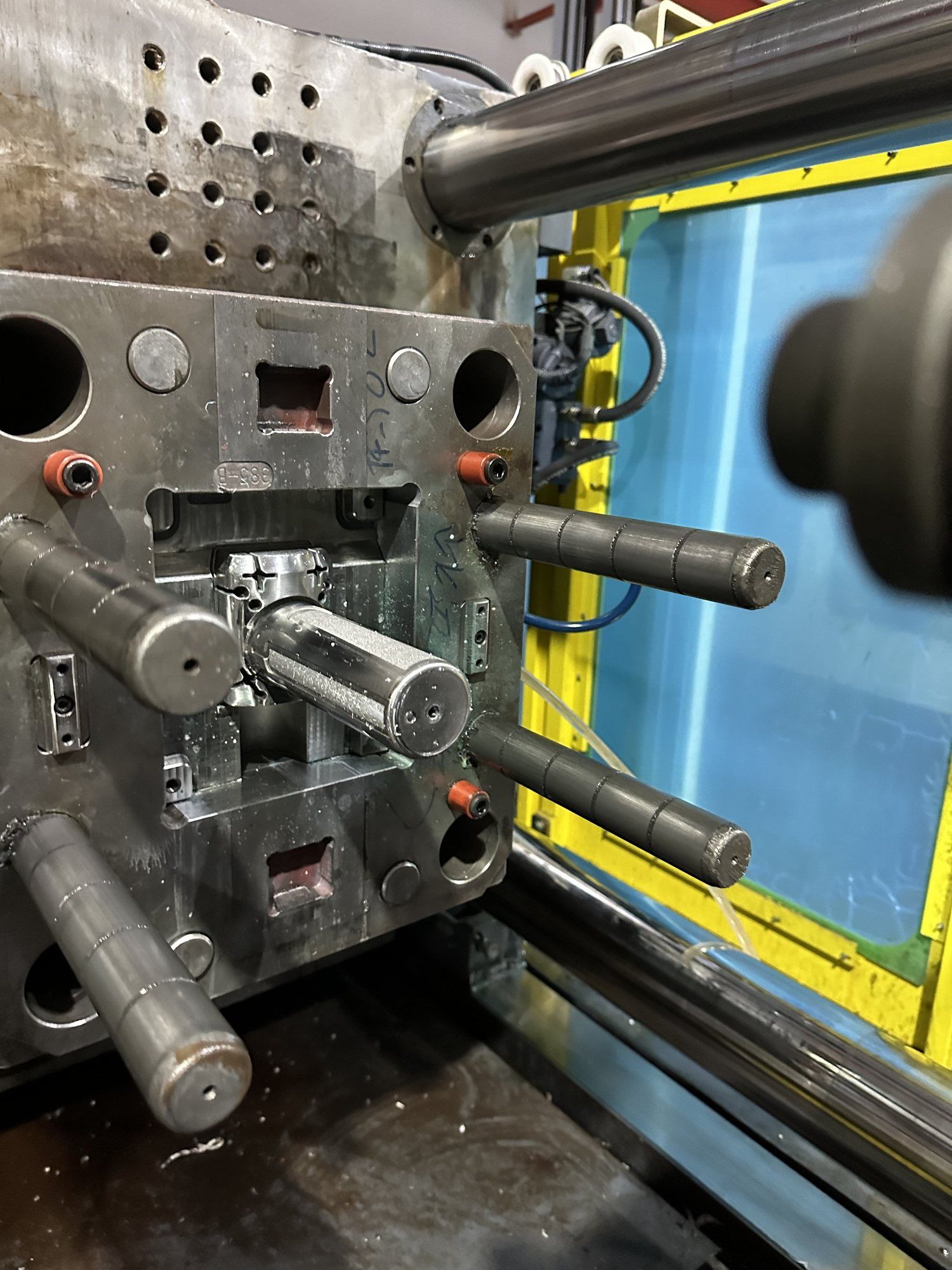 An injection mould mounted in a moulding press.